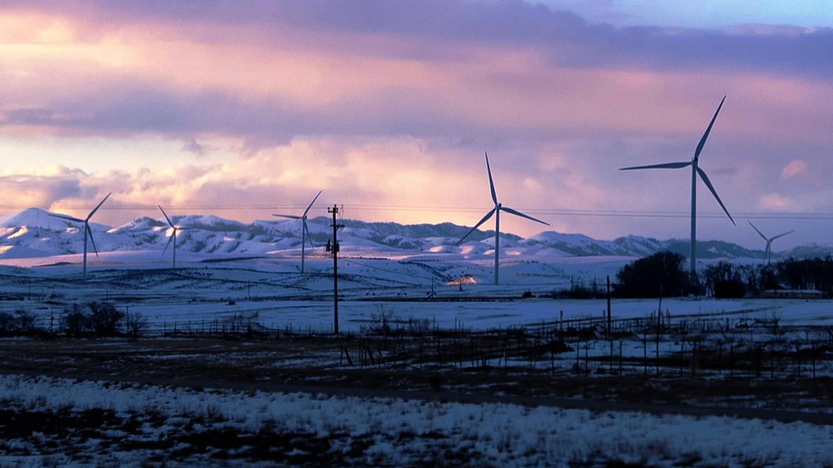 Windmills in front of sunset